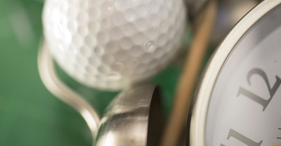Clock and golf balls