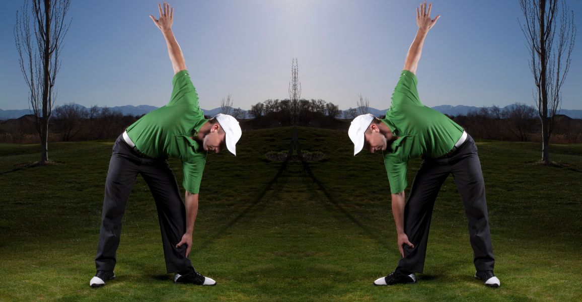 Man dressed in green stretching on a golf course