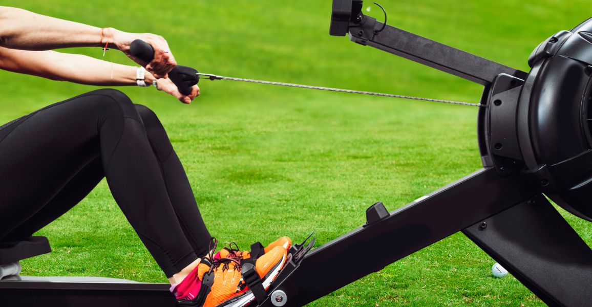 Woman only getting started on a rowing machine for golf