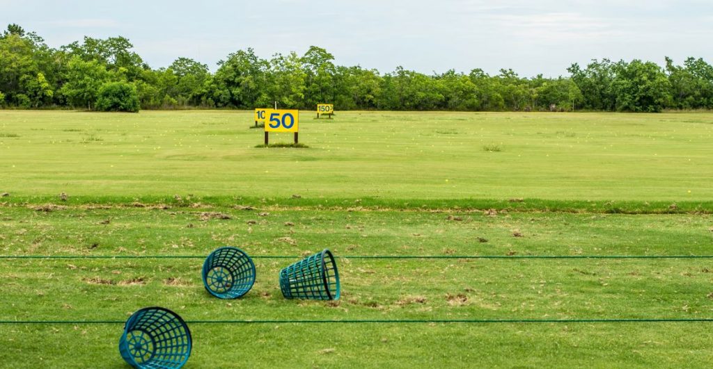empty driving range baskets at the end of a practice session