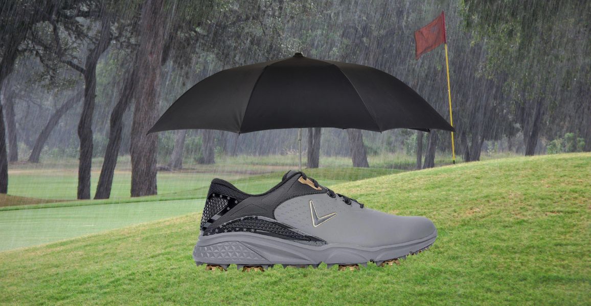 spiked golf shoe and a black umbrella on a wet golf course