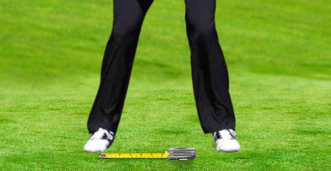 golfer standing shoulder width apart with a measuring tape at his feet